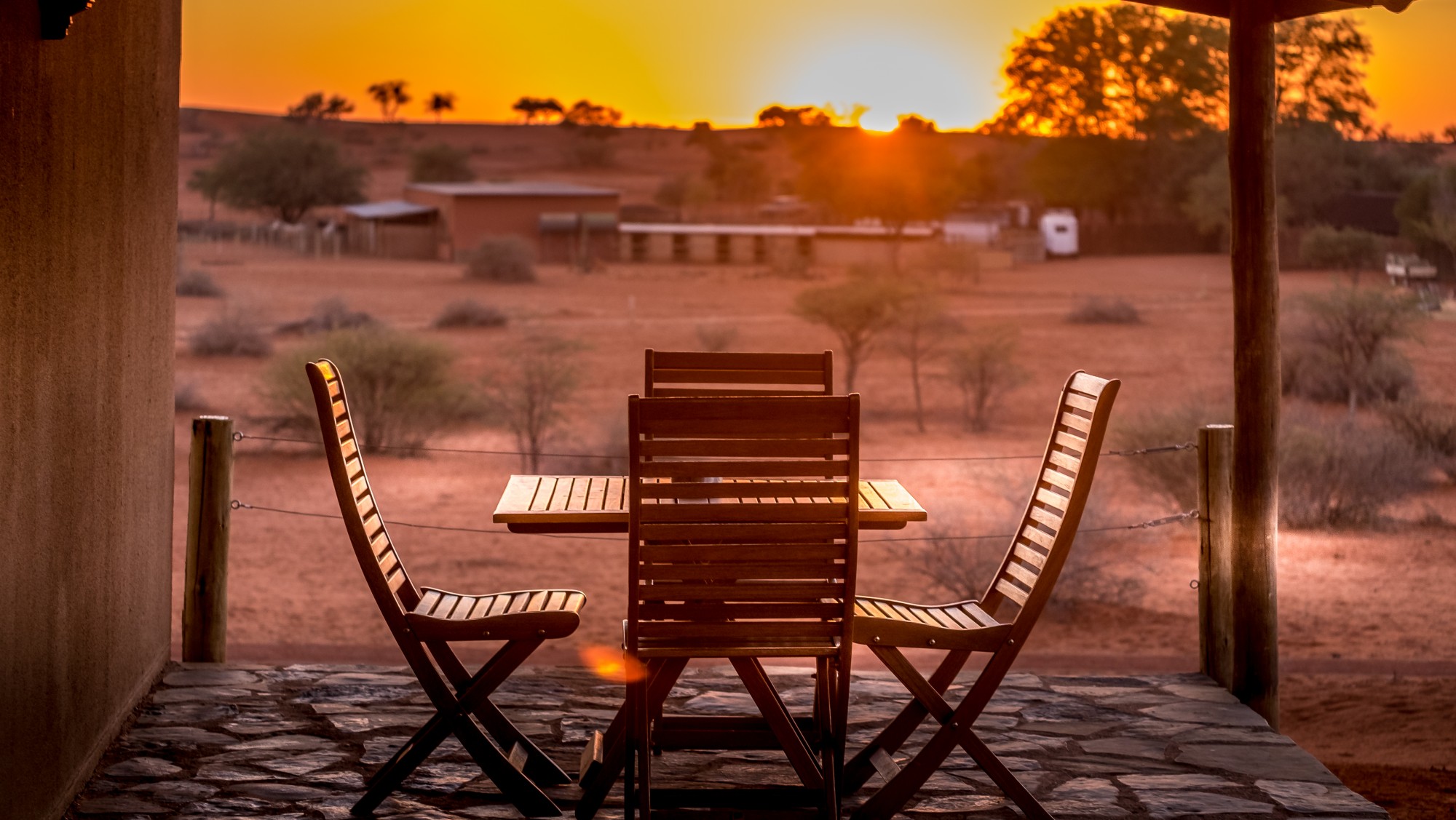 Bagatelle Lodge - Kalahari Game Ranch - Namibia - Guest Room terrace at sunset2